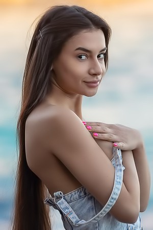 Vanessa Alessia Teases In A Denim Dress On A Beach Towel Under Golden Light