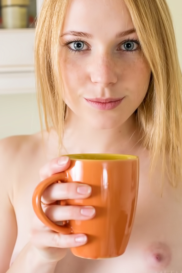 Petite teen naked in the kitchen