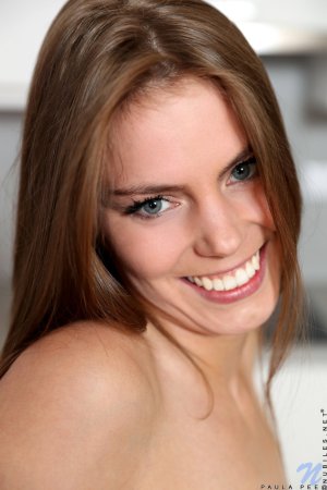 Sweet brunette has fun with a toy photo 11