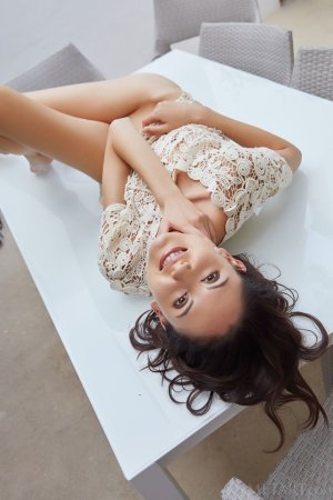 Naked brunette on the table photo 14