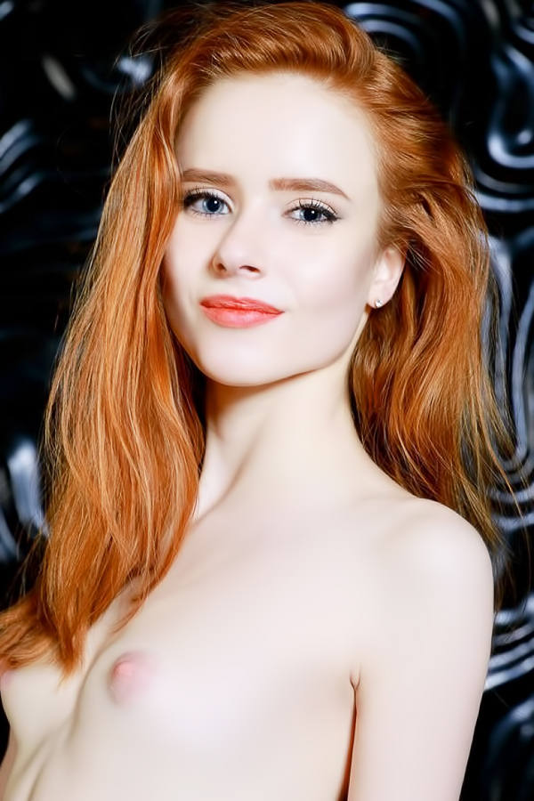 Redhead blue eyed MILF beauty