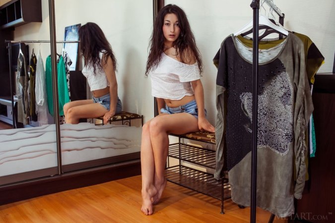 Dark-haired babe tries on sexy outfits photo 13