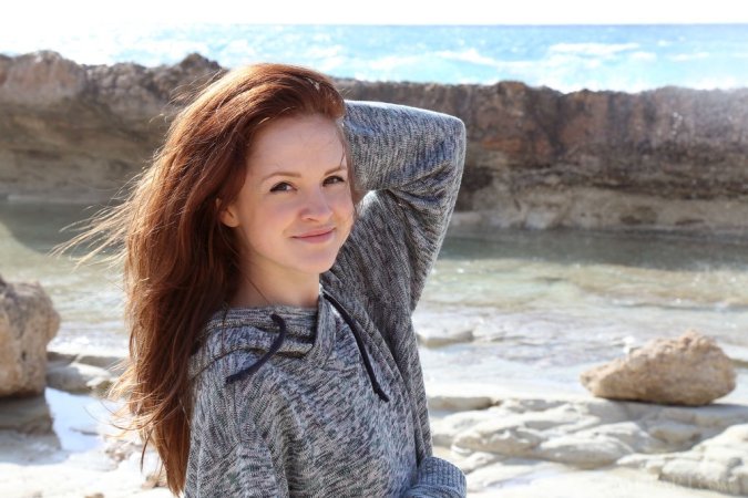 Sweetie undresses on a beautiful shore photo 10