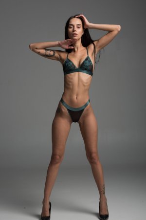 Skinny brunette poses on camera photo 13